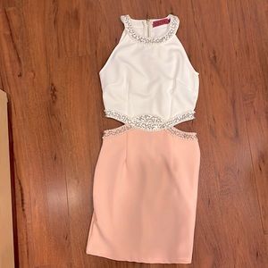 Sleeveless dress with beading and side cut outs